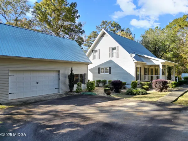 a backyard of a house with lots of green space