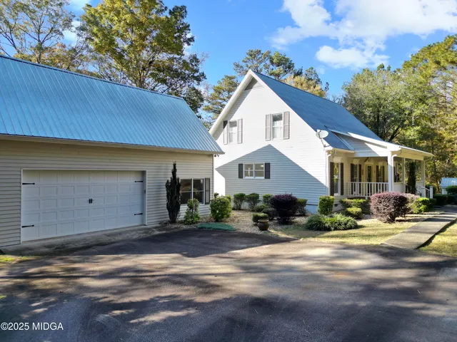 a backyard of a house with lots of green space