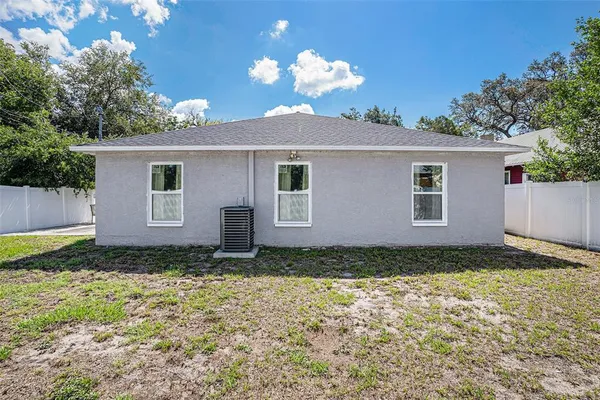 a house view with a backyard space