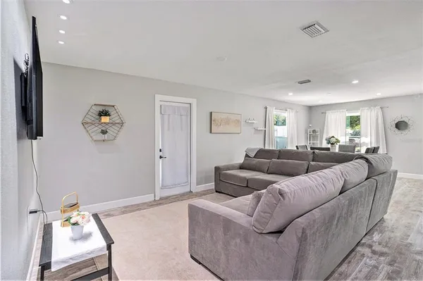 a living room with furniture and a window