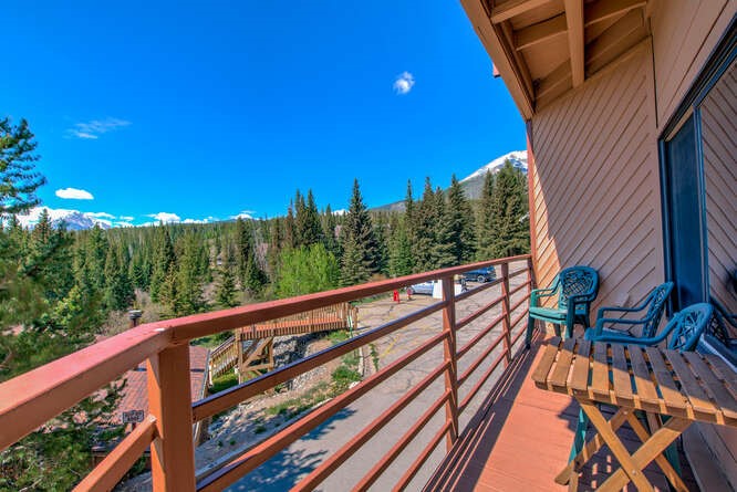 98000 Ryan Gulch Road, Unit E104 Silverthorne, CO 80498 - Photo 16 of 31 Balcony with a wooded view