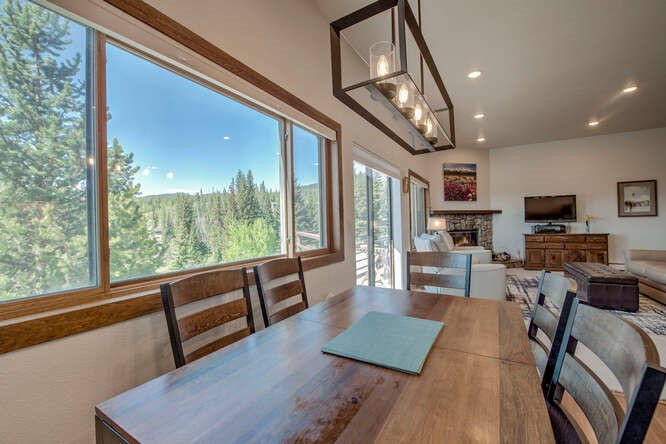 98000 Ryan Gulch Road, Unit E104 Silverthorne, CO 80498 - Photo 10 of 31 Dining area featuring a stone fireplace and recessed lighting