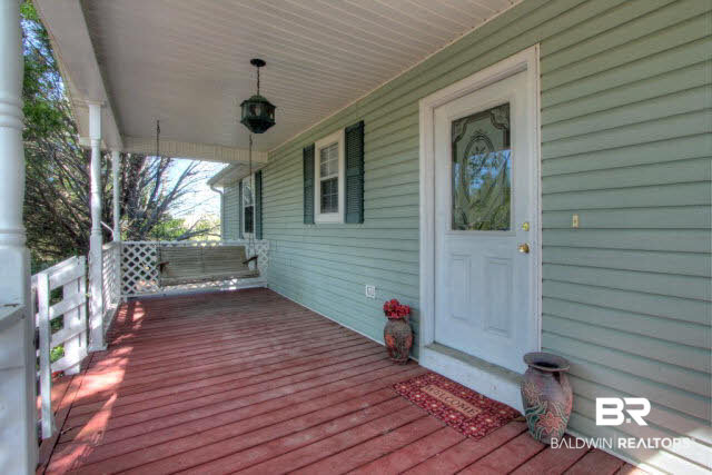 23220 T D Barnett Road Robertsdale, AL 36567 - Photo 5 of 24 front porch