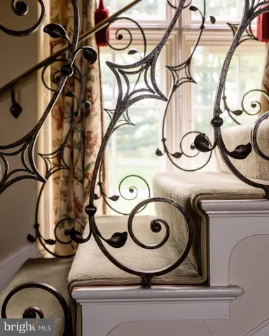 an aerial view of green landscape with trees houses and lake view