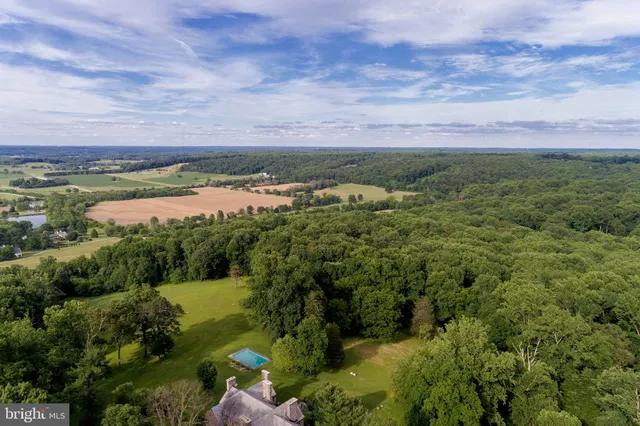 a backyard of a house with outdoor seating and green space