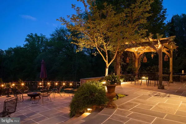 a backyard of a house with outdoor seating and green space