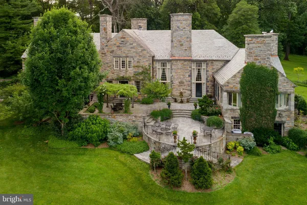 a house that has tree in front of it