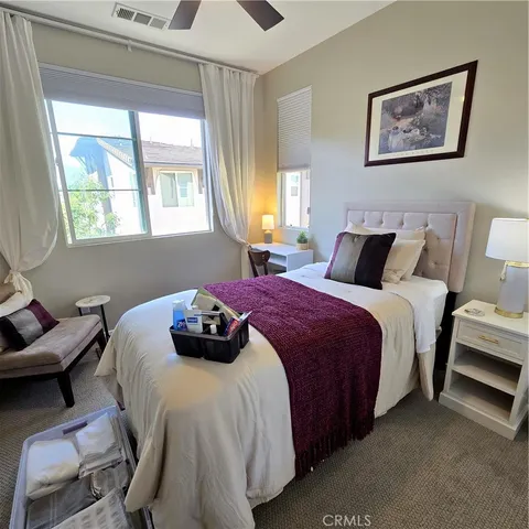 a bedroom with bed and a window