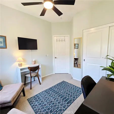 a bedroom with a bed and a walk in closet