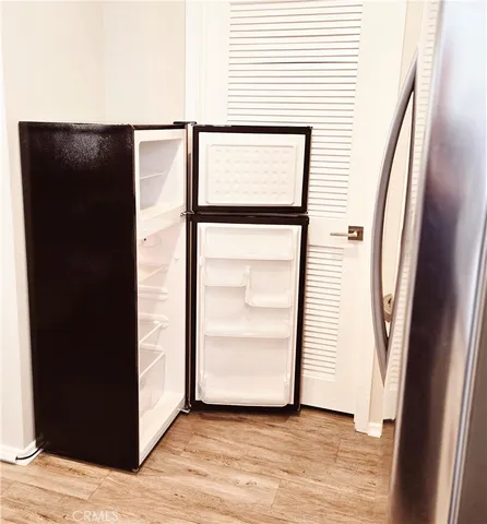 an entryway with a hardwood floor