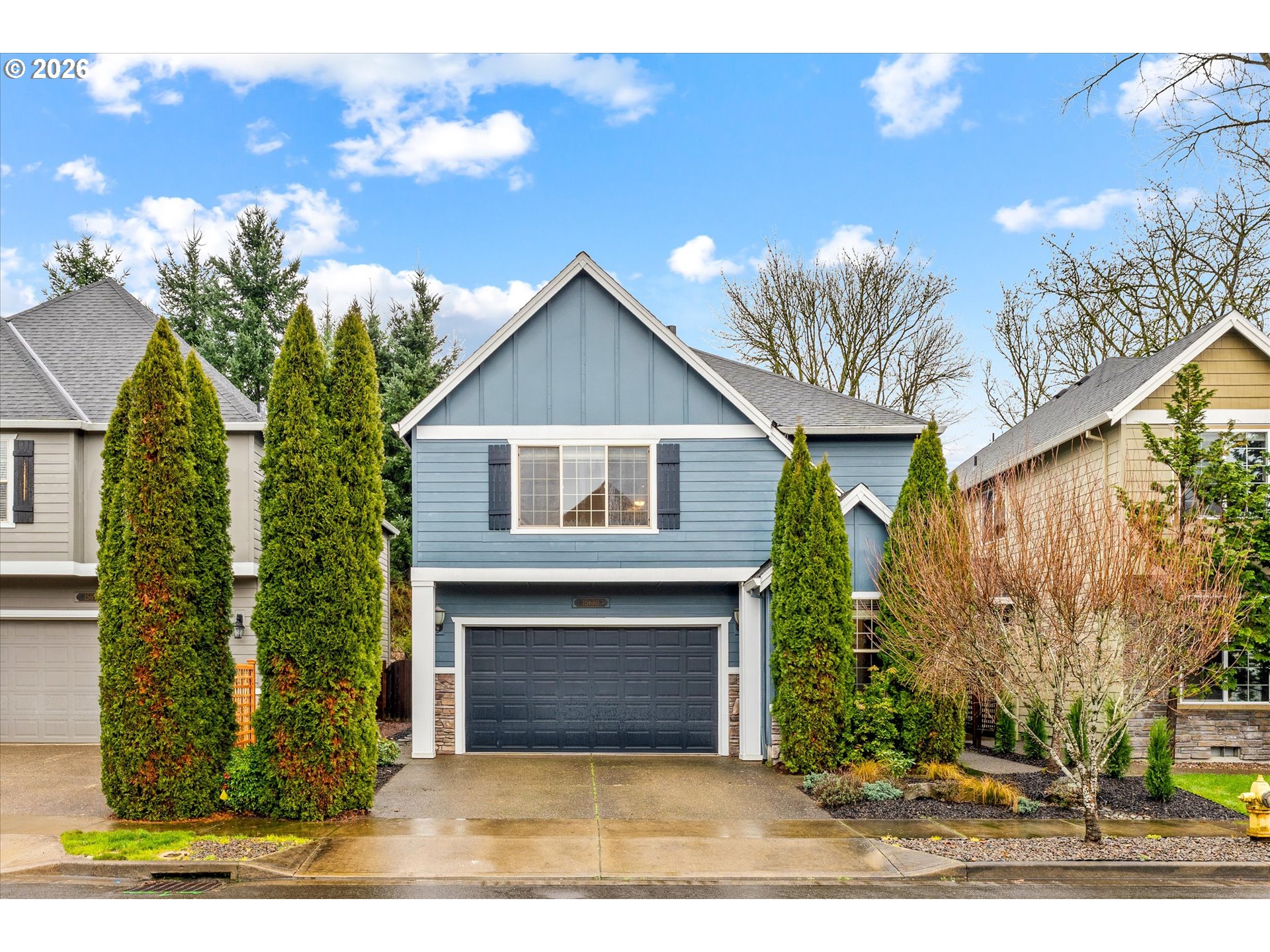 15680 Southwest 81st Avenue Tigard, OR 97224 - Photo 1 of 33 a front view of a house with a garden