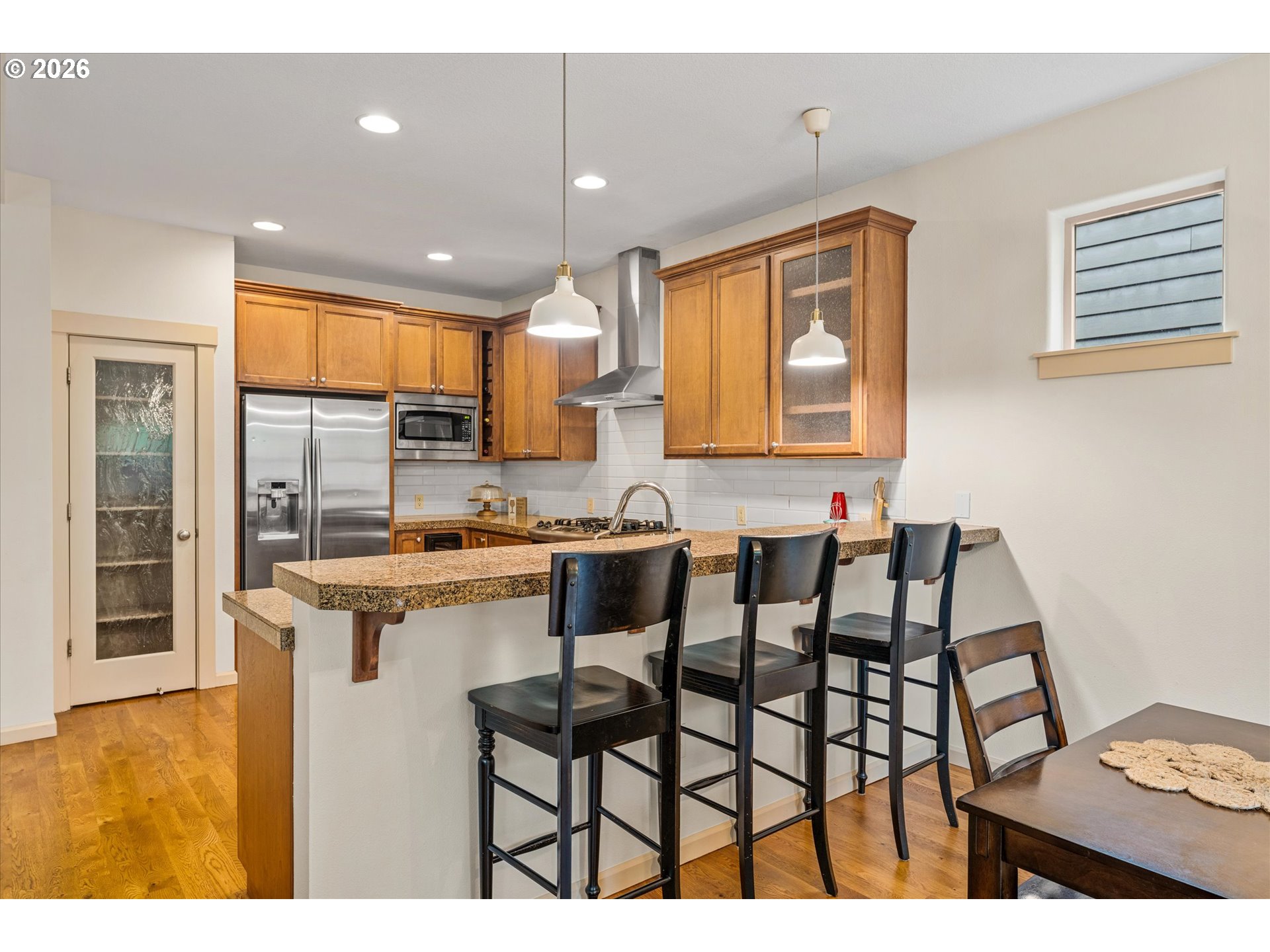 15680 Southwest 81st Avenue Tigard, OR 97224 - Photo 11 of 33 a kitchen with a dining table chairs and window