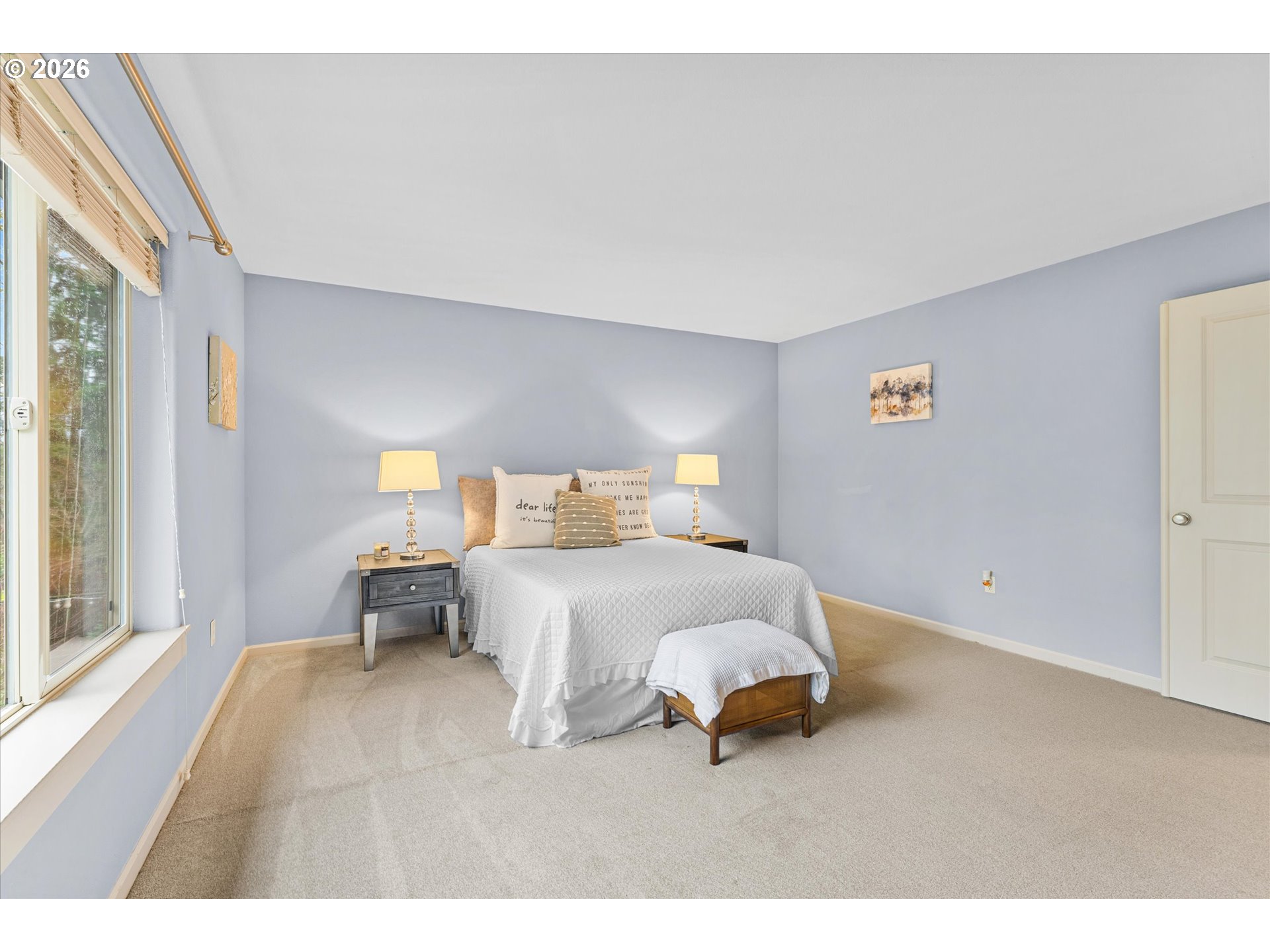 15680 Southwest 81st Avenue Tigard, OR 97224 - Photo 20 of 33 a bedroom with a bed and wooden floor