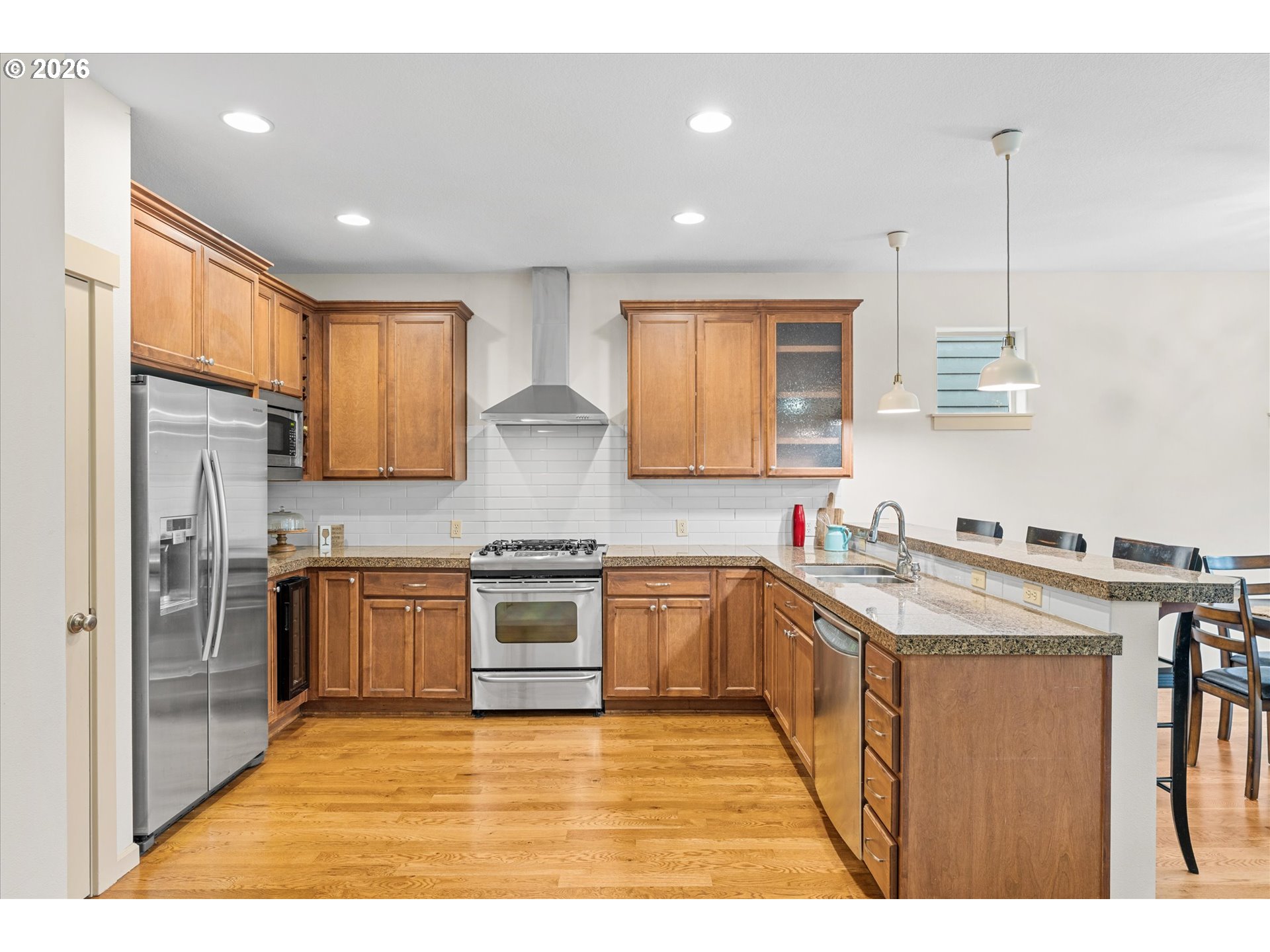 15680 Southwest 81st Avenue Tigard, OR 97224 - Photo 2 of 33 a kitchen with stainless steel appliances granite countertop a sink stove and refrigerator