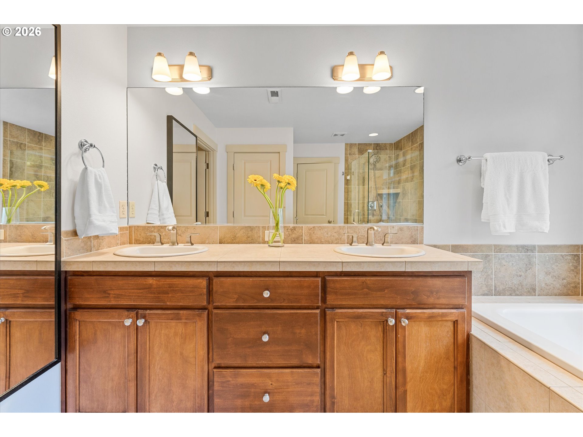 15680 Southwest 81st Avenue Tigard, OR 97224 - Photo 25 of 33 a bathroom with a sink double vanity and a mirror
