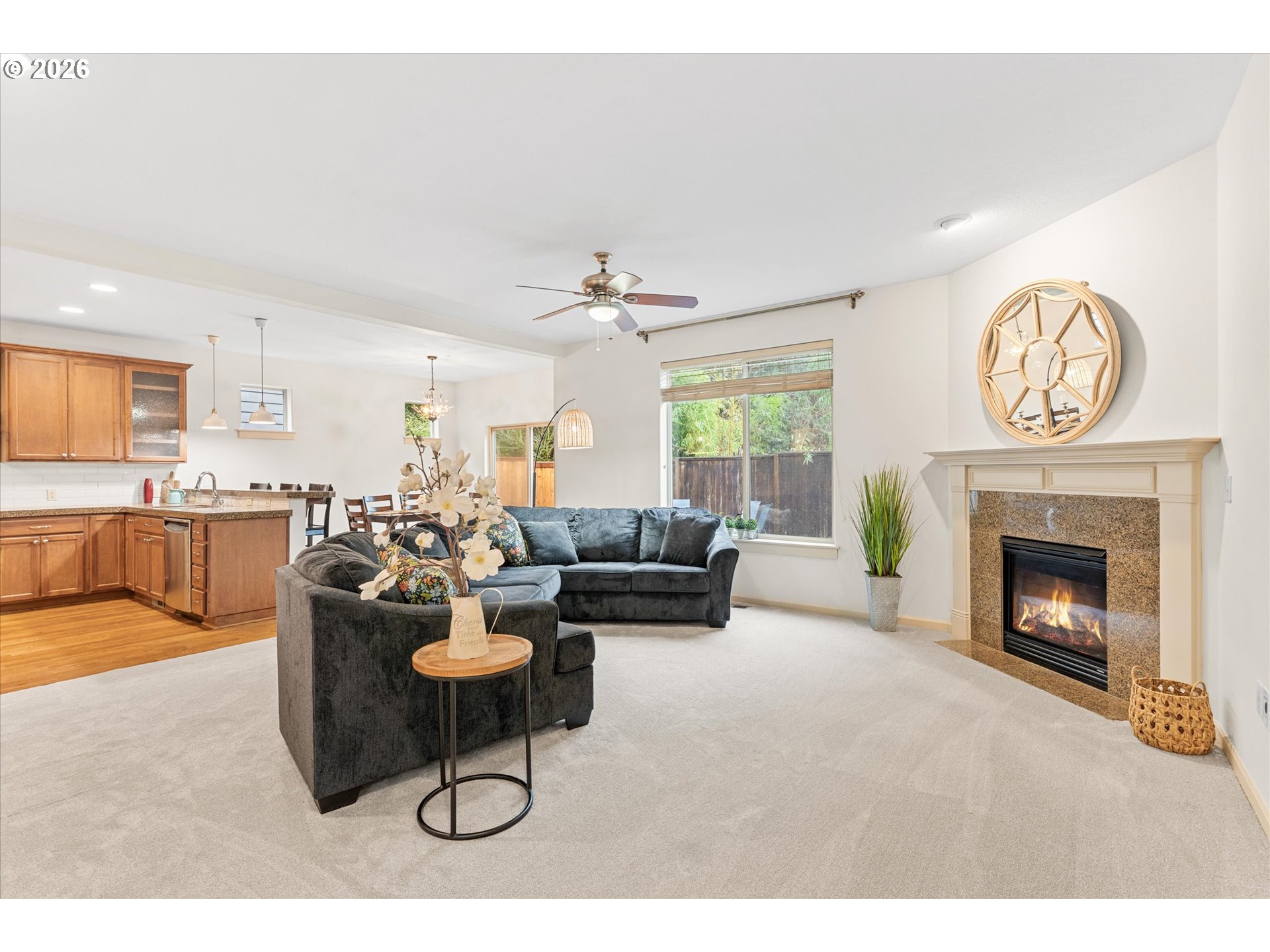 15680 Southwest 81st Avenue Tigard, OR 97224 - Photo 6 of 33 a living room with furniture a fireplace and a large window