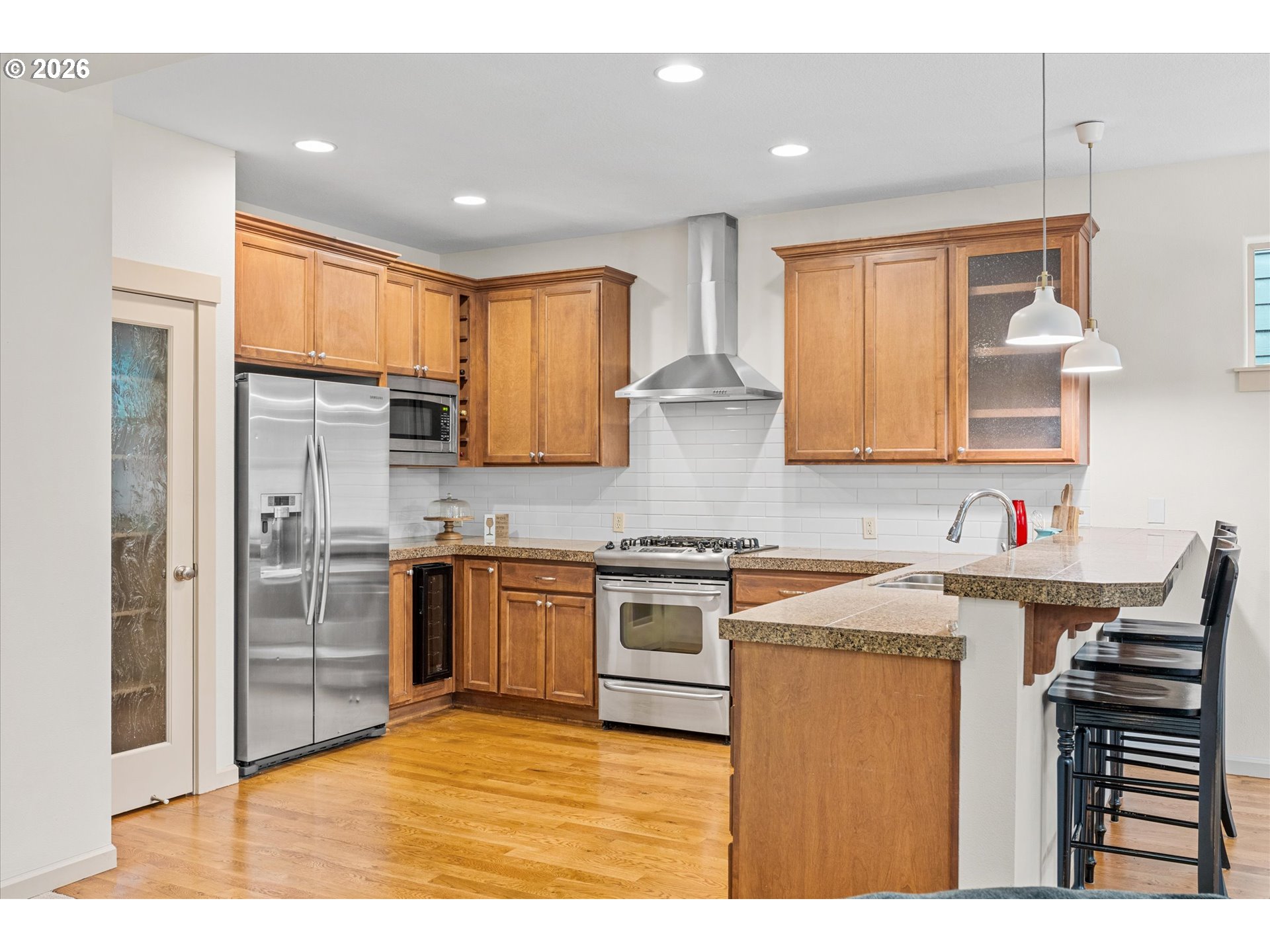 15680 Southwest 81st Avenue Tigard, OR 97224 - Photo 10 of 33 a kitchen with stainless steel appliances granite countertop a sink stove and refrigerator