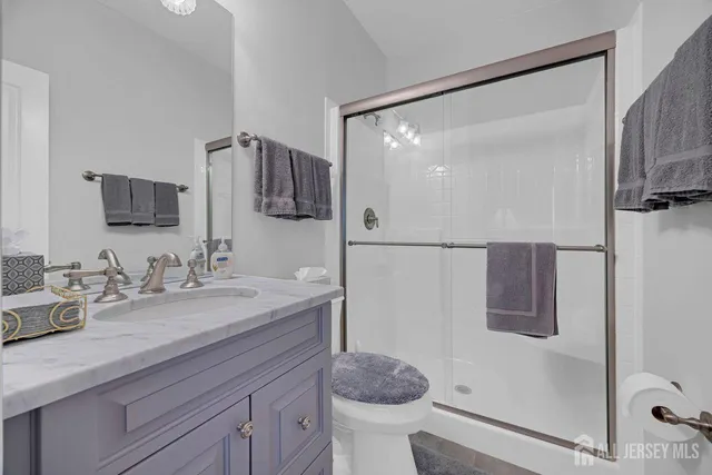 a living room with furniture a ceiling fan and a window