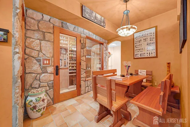 a kitchen with stainless steel appliances kitchen island granite countertop a stove and cabinets