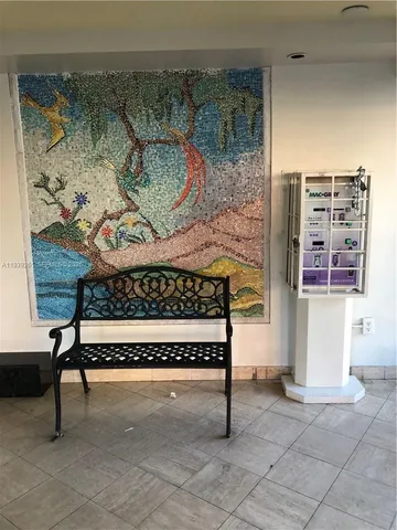 a view of hallway with livingroom and stairs