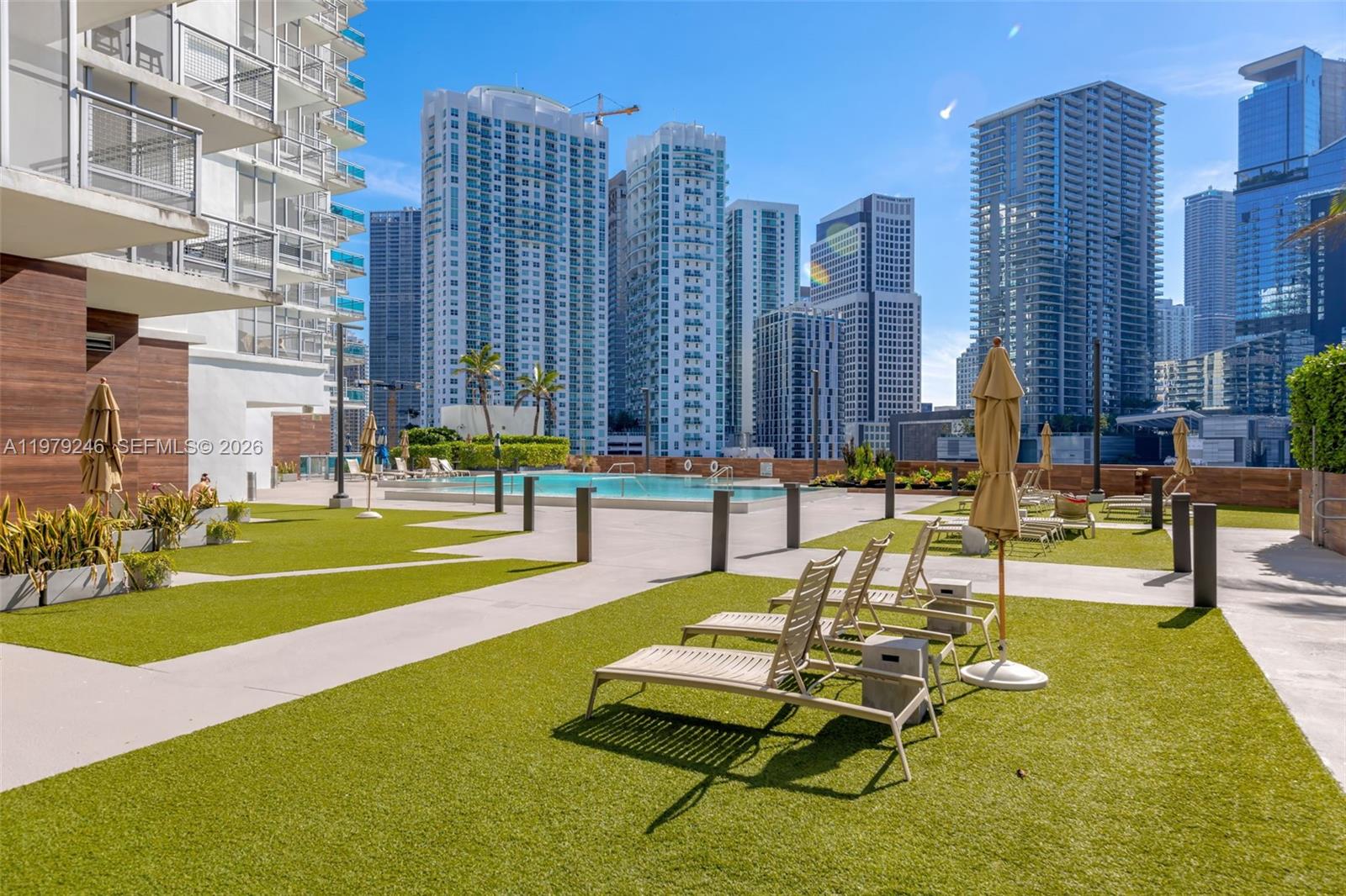 350 South Miami Avenue, Unit 2006 Miami, FL 33130 - Photo 31 of 33 a swimming pool with outdoor seating and yard