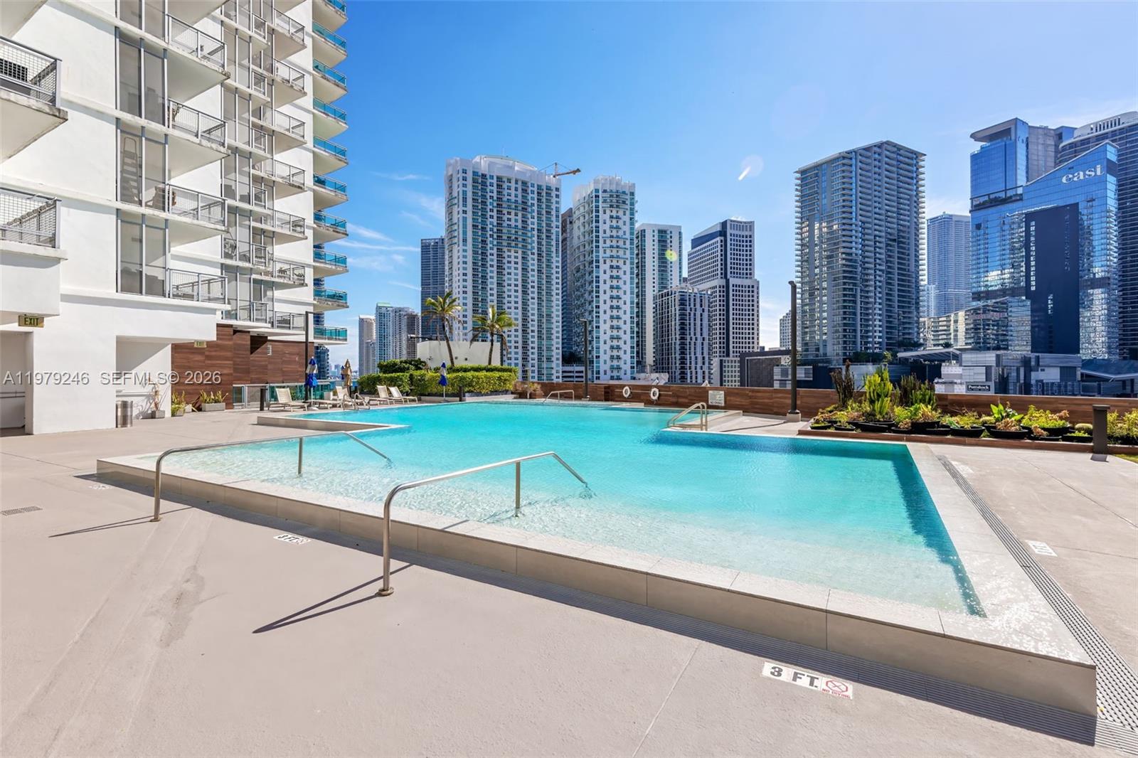 350 South Miami Avenue, Unit 2006 Miami, FL 33130 - Photo 32 of 33 a swimming pool with outdoor seating and yard