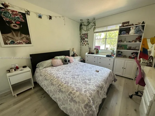 a bedroom with a bed and furniture