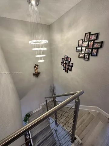 a view of hall way with furniture