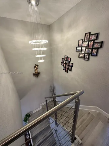 a view of hall way with furniture