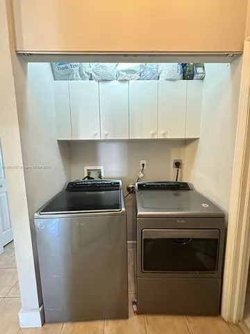 a kitchen with a stove and a microwave