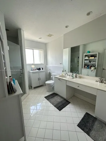 a kitchen with a sink appliances and cabinets