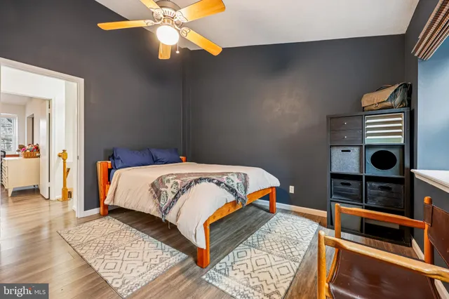 a bedroom with a bed and a walk in closet