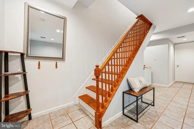 a view of staircase with a rug