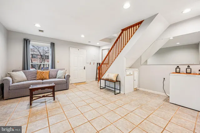 a bedroom with a bed and a chair