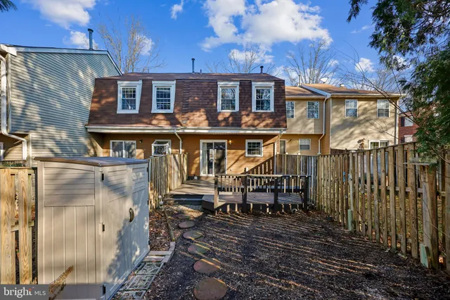 a view of a house with wooden deck