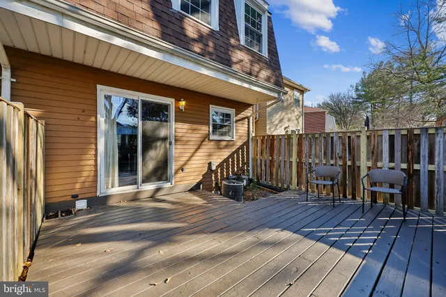 a view of a house with wooden deck