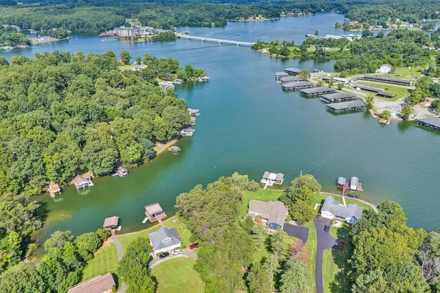 an aerial view of a house with a lake view
