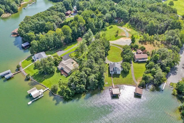 an aerial view of a house with a yard and garden