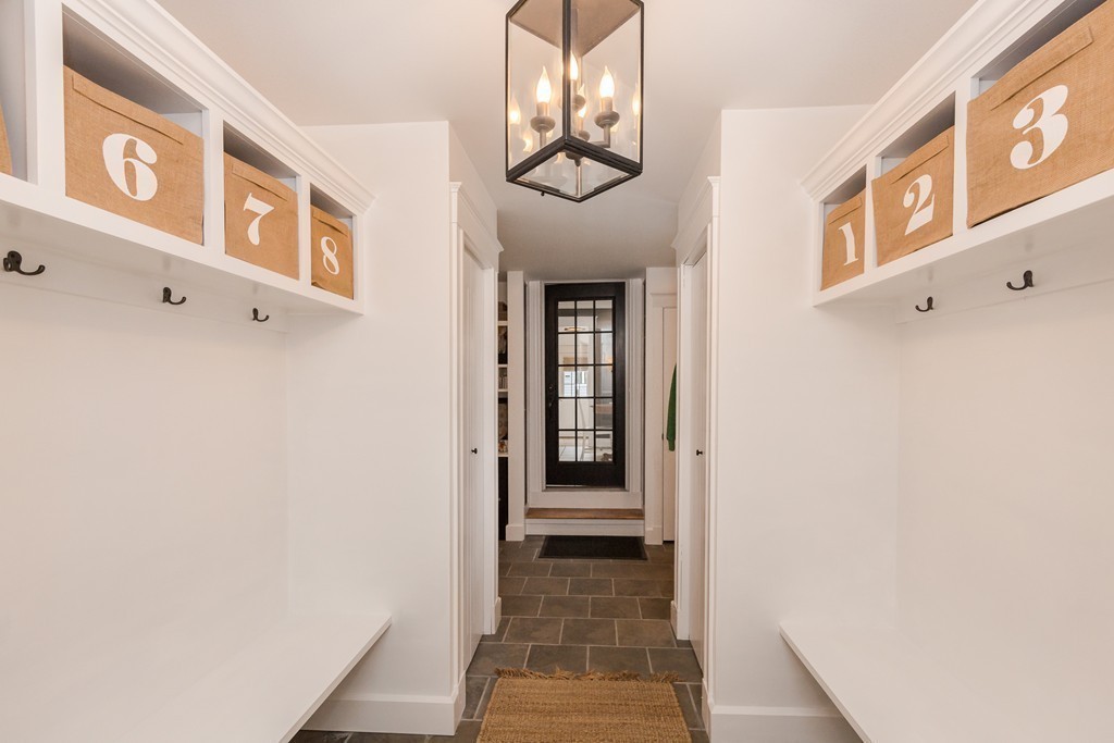 10 Bridge Street Hamilton, MA 01982 - Photo 13 of 30 a hallway with wooden floor and a potted plant