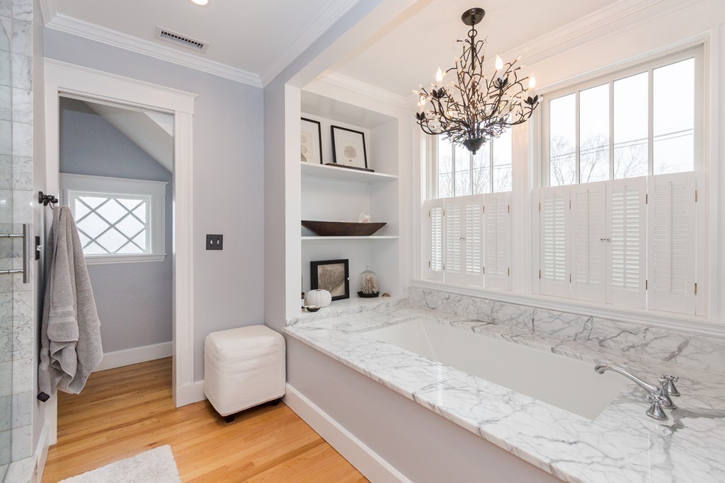 10 Bridge Street Hamilton, MA 01982 - Photo 15 of 30 a bathroom with a granite countertop tub sink and mirror