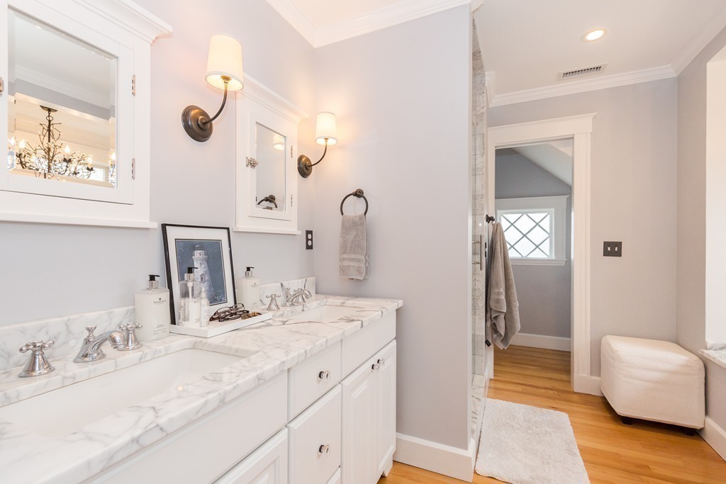 10 Bridge Street Hamilton, MA 01982 - Photo 16 of 30 a bathroom with a double vanity sink mirror and shower