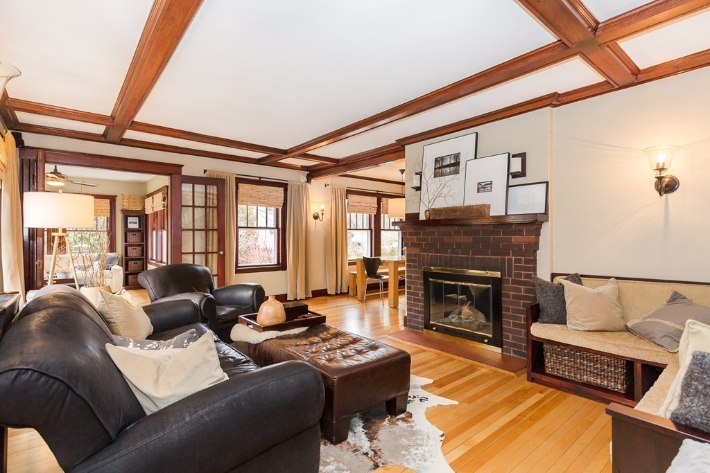 10 Bridge Street Hamilton, MA 01982 - Photo 5 of 30 a living room with furniture a fireplace and a table