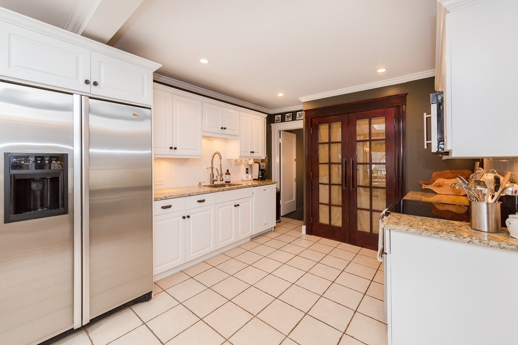 10 Bridge Street Hamilton, MA 01982 - Photo 9 of 30 a kitchen with stainless steel appliances granite countertop a refrigerator and a sink