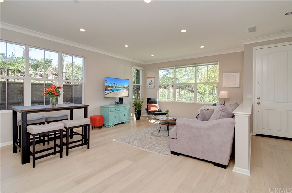 181 Working Ranch Irvine, CA 92602 - Photo 1 of 1 Extra natural light with oversized windows...being a corner unit adds even more light to this beautiful living room!