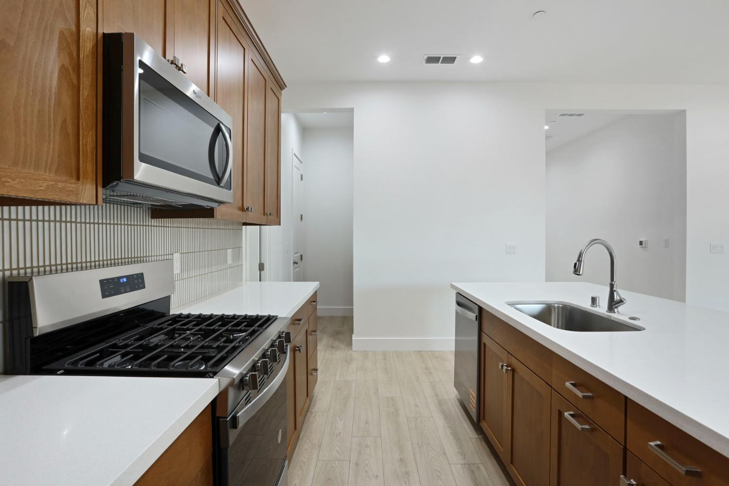 2288 Paramount Lane Manteca, CA 95337 - Photo 8 of 25 Peek to Dirty Kitchen and Walk-in Pantry