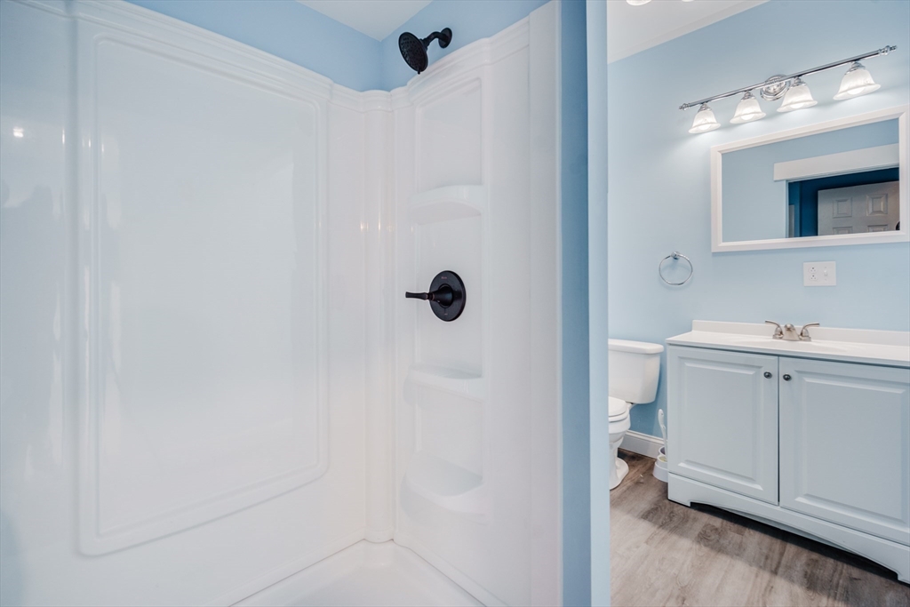 174 Allen Street Springfield, MA 01108 - Photo 11 of 37 a bathroom with a sink a toilet and shower
