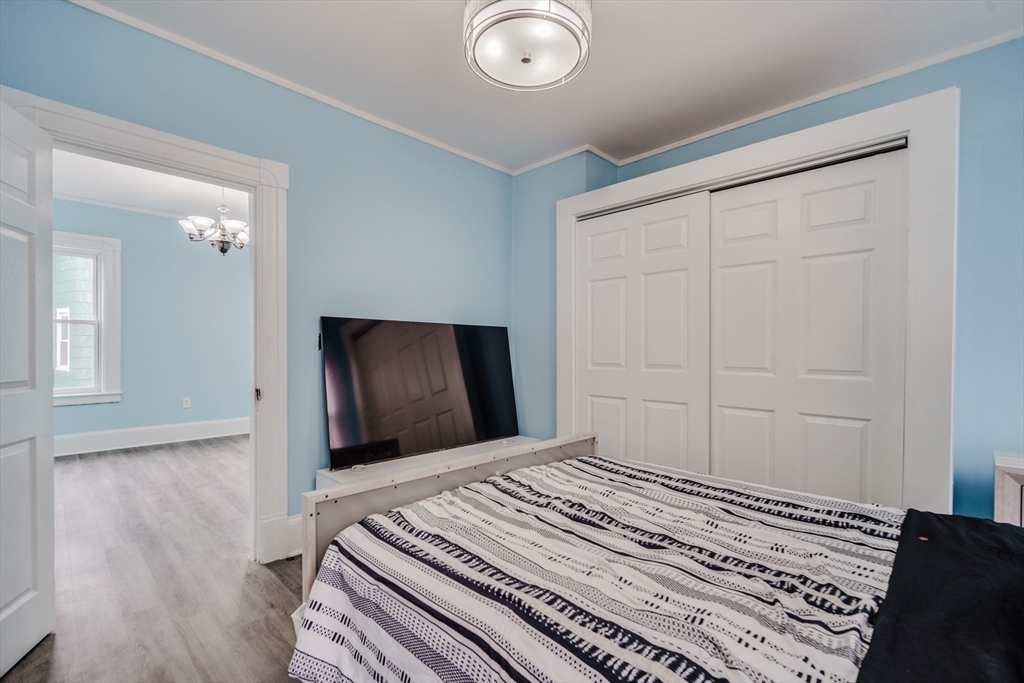 174 Allen Street Springfield, MA 01108 - Photo 13 of 37 a bedroom with a bed and a dresser