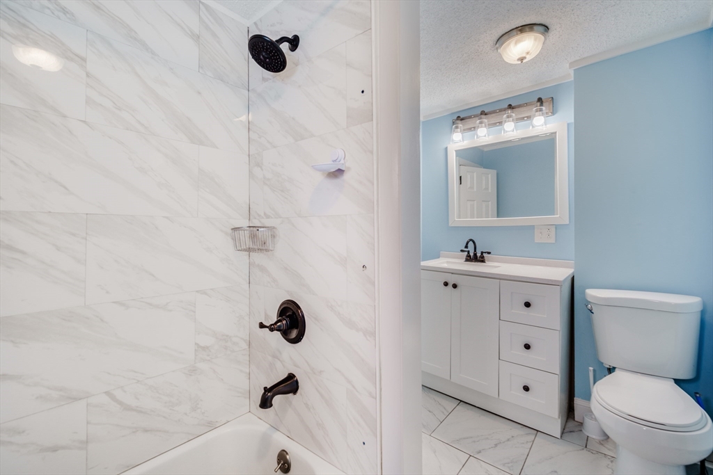 174 Allen Street Springfield, MA 01108 - Photo 18 of 37 a bathroom with a sink a toilet and shower