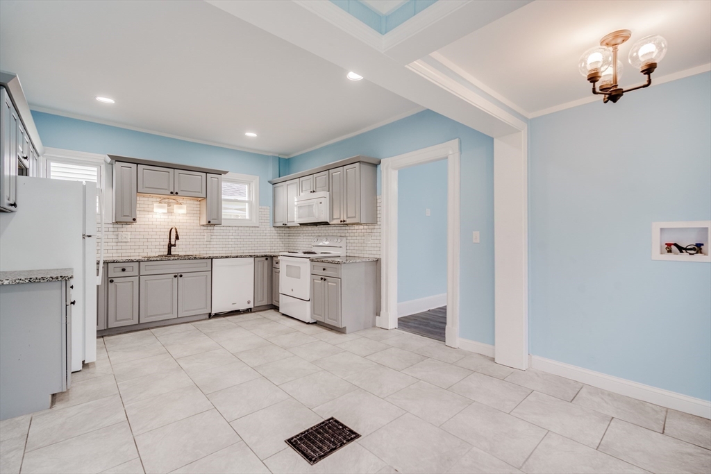 174 Allen Street Springfield, MA 01108 - Photo 4 of 37 a kitchen with white cabinets and white appliances