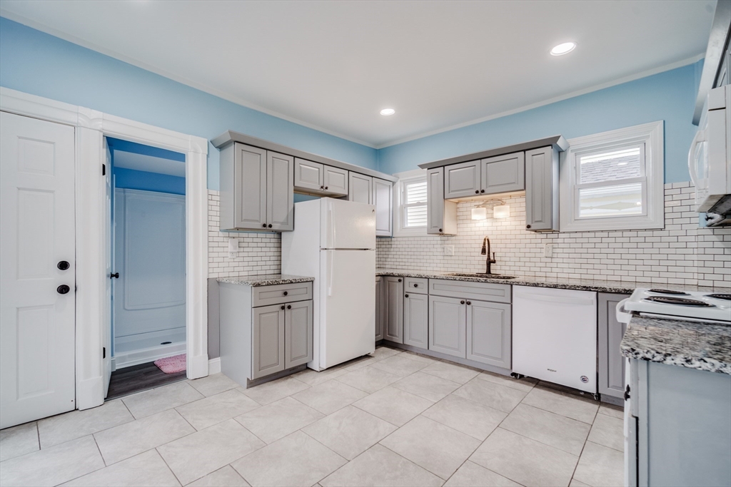 174 Allen Street Springfield, MA 01108 - Photo 5 of 37 a kitchen with sink and refrigerator